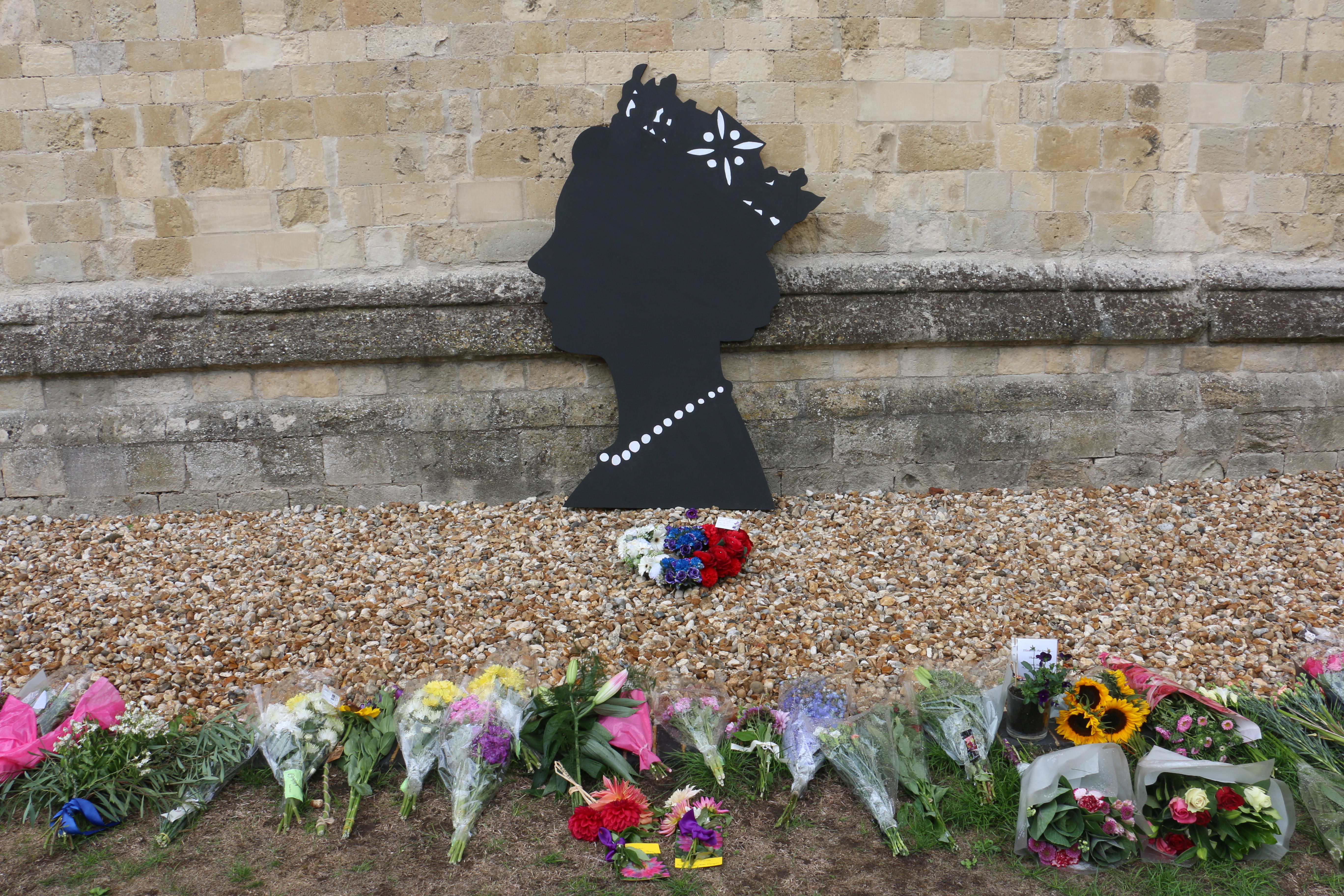 Her Late Majesty Queen Elizabeth II's silhouette in Paradise with flowers