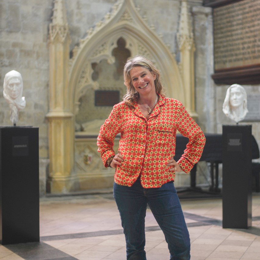 Kate Viner stands in front of her sculptures