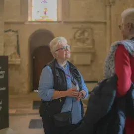 A Cathedral Welcomer greets visitors