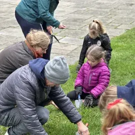 Children help plant bulbs