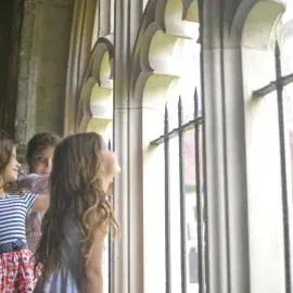 children look in the cathedral cloisters