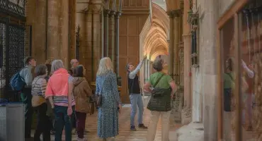 A guide gives a tour of the Cathedral aisles