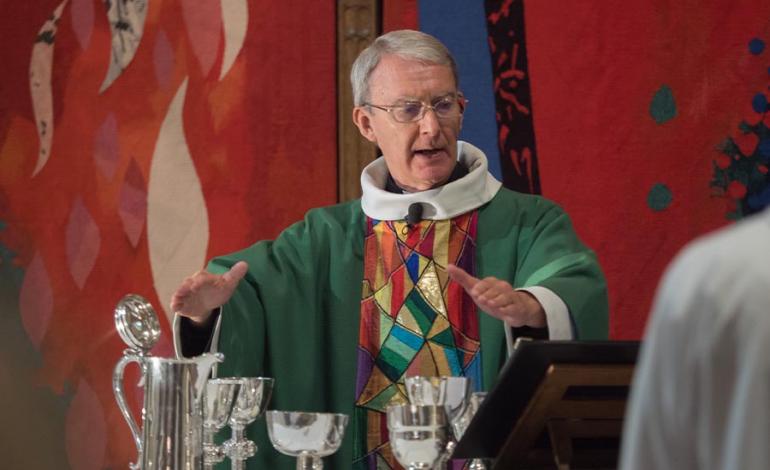 Canon Tim Schofield presiding over Sunday Eucharist