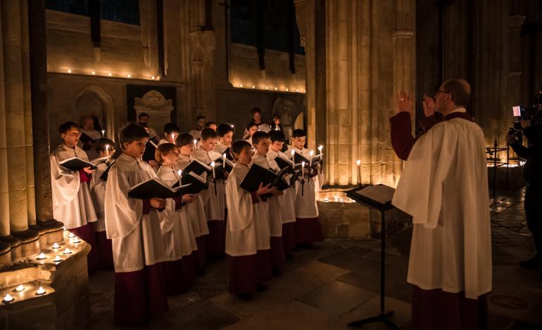 choir singing by candlelight at Advent Procession