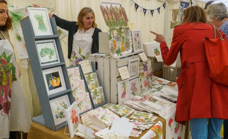 People browsing at an artist's stand