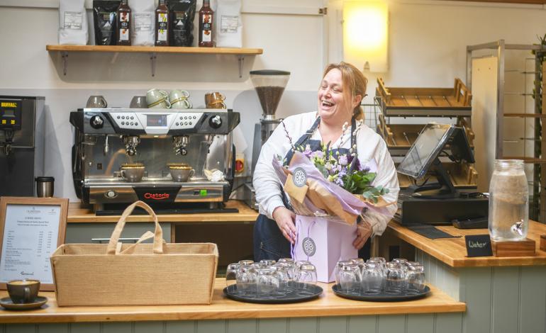General Manager of the Cafe, Lorraine Sneller, receives flowers