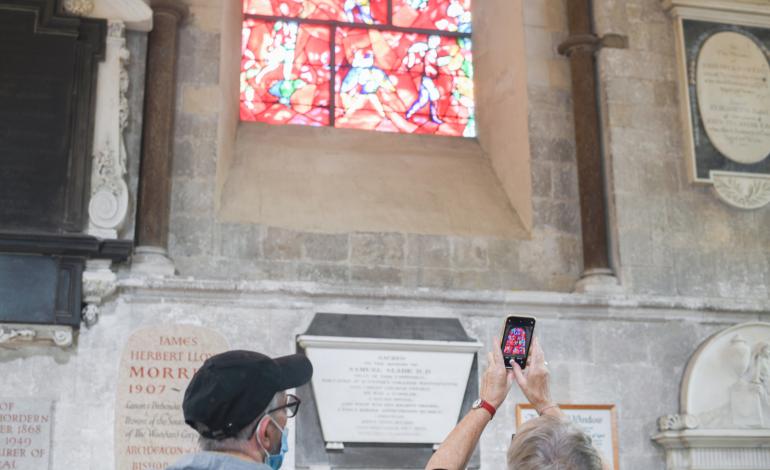 Visitors take photographs of the famous Marc Chagall window