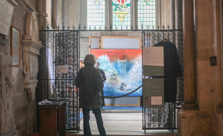 Visitors observe Anne's work