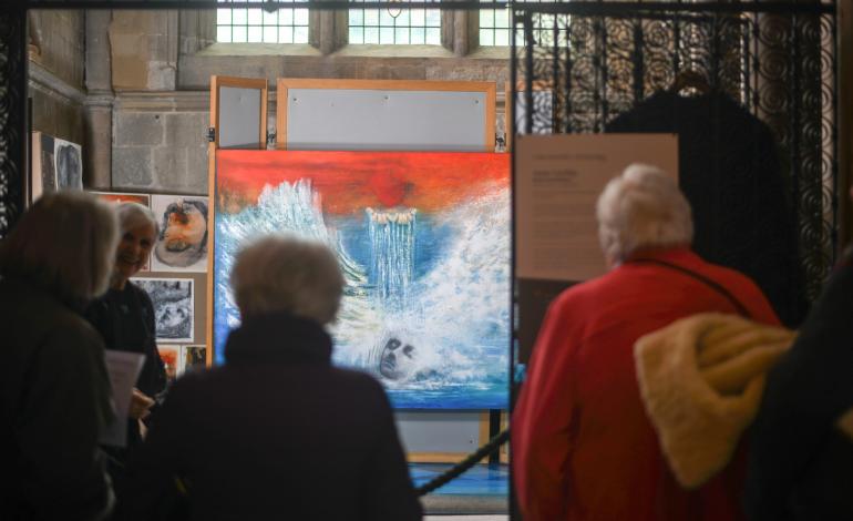 Anne speaks to visitors about her work