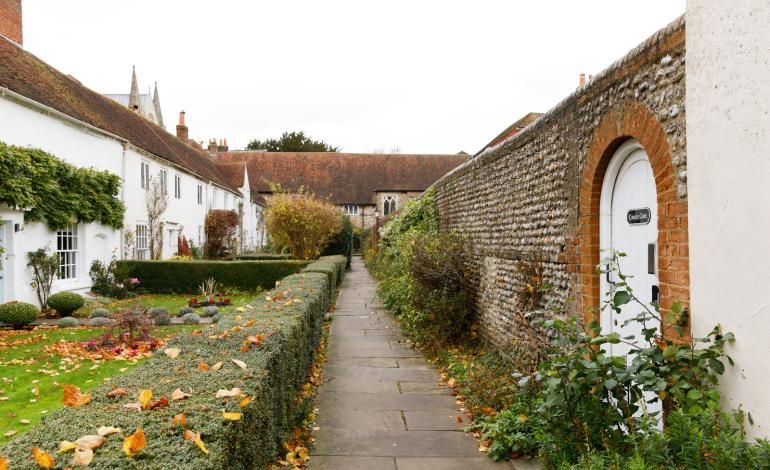 Entrance to Canon Gate down Vicars' Close, a shrubbery lined walkway to the cathedral