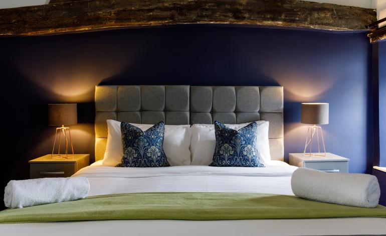 Large double bed which can be 2 singles,with2 bedside tables with lamps