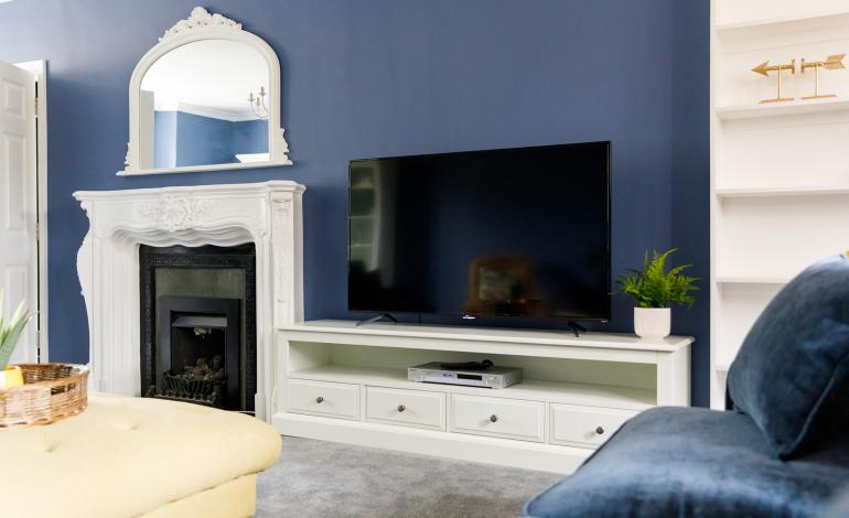 Lounge details, flat screen TV and fireplace