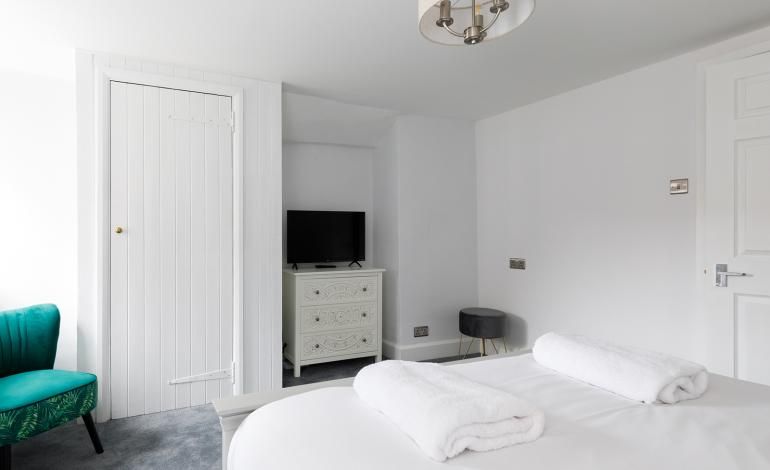 Double bedroom  1with wardrobe, Flat screen TV , drawers and chair