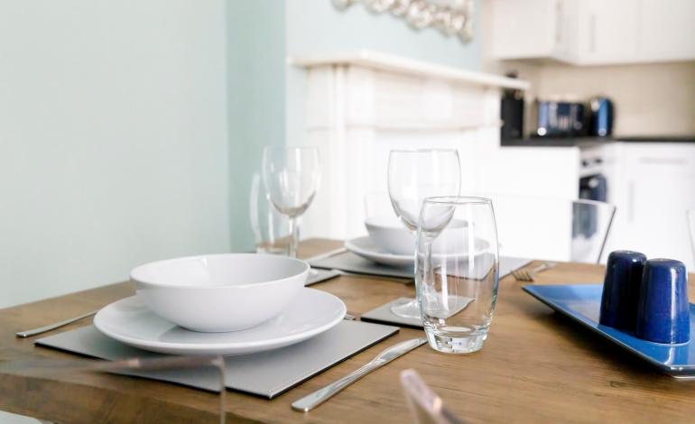 Dining table with place settings for 2. 