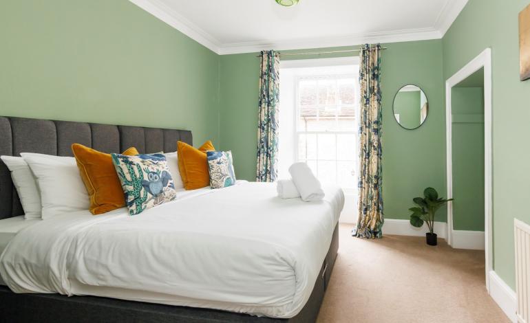 Bedroom view with window and storage