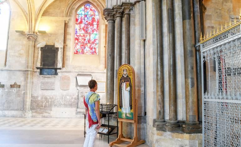 A visitor views the Mosaic of Saint Dominic