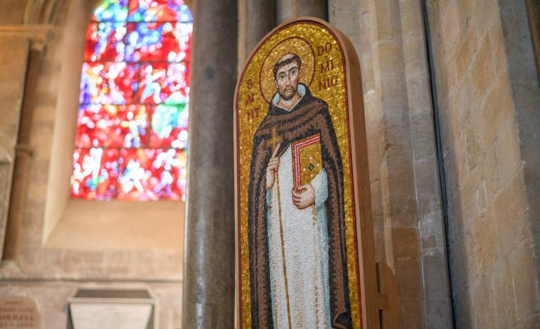 Mosaic of St Dominic with Marc Chagall window in the background