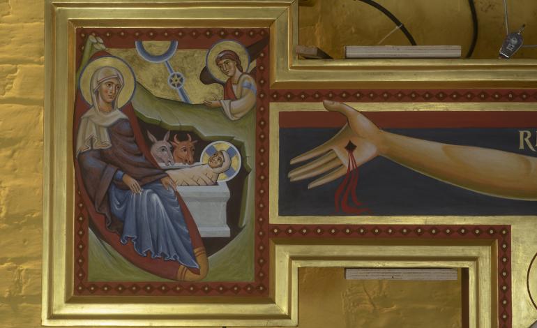 Nativity depiction on the left side of the crucifix painted in egg tempura with burnished gold background