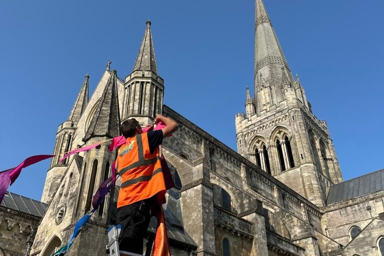 Installing bunting on the Cathedral Green